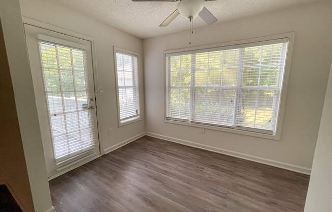 The Crest at Berkeley Lake St James renovated sunroon with wood style plank flooring located in Duluth, GA 30096
