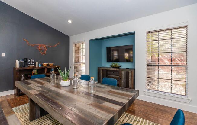 a living room filled with furniture and a large window