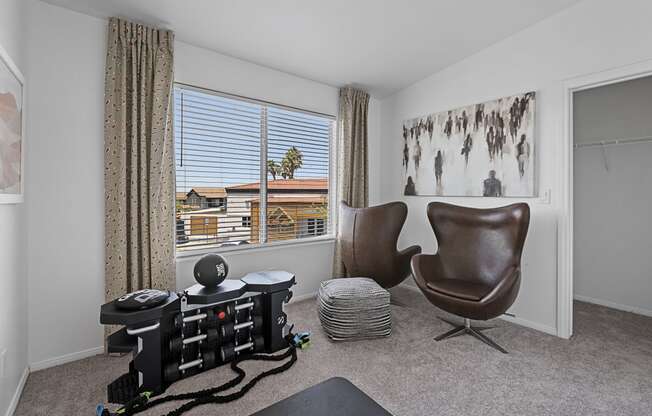 a living room with a chair and a table and a window