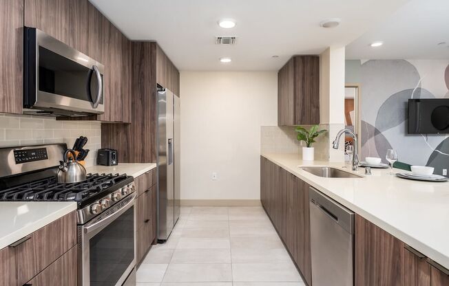 a view of a room with a counter and a tv in it