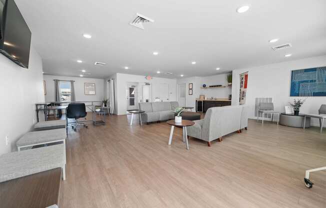 a living room with couches and chairs  at Union at Wiley, Cedar Rapids, IA, 52404