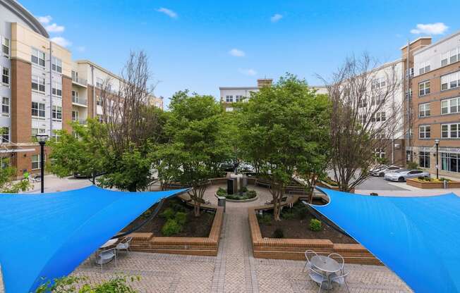 A courtyard with a blue tarp covering the ground.