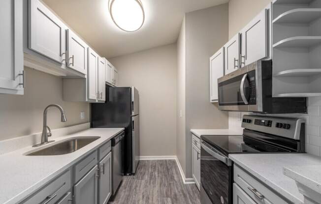 the preserve at ballantyne commons apartment kitchen with stainless steel appliances and white
