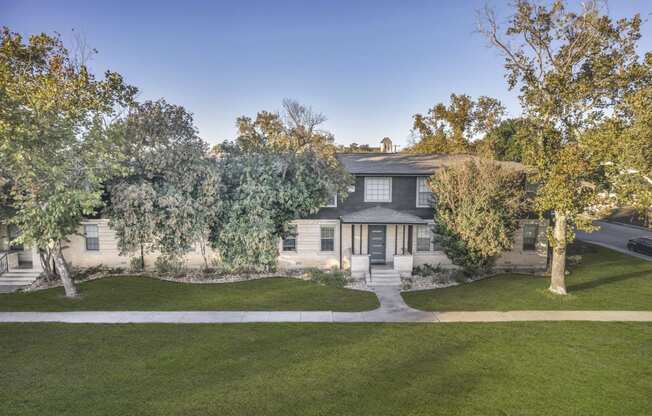 the front of a house with trees and a sidewalk  at Sunset Ridge, San Antonio, TX, 78209