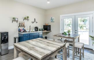 a living room with a sink and a window