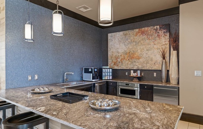 a kitchen with a counter top and a sink