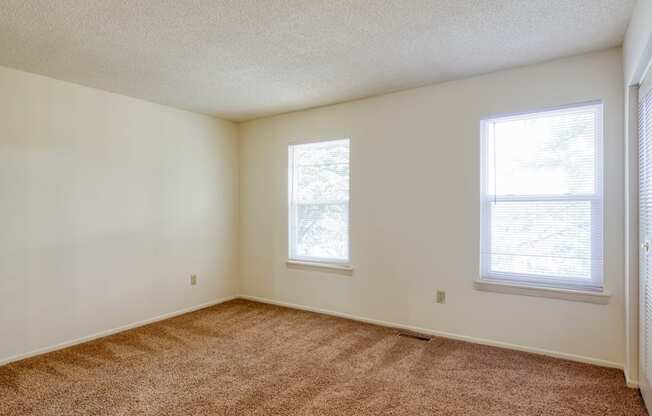 Bedroom with two large windows at The Everett  Apartments in Roanoke, VA 24018