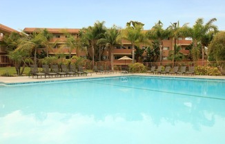 Ocean Breeze Villas Pool with Lounge Chairs