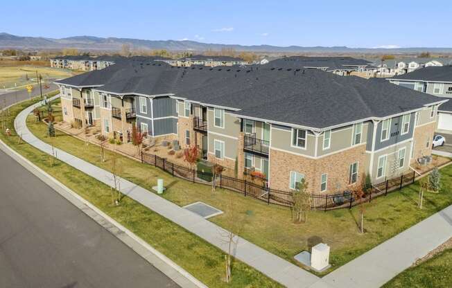 an aerial view of a row of houses on a street