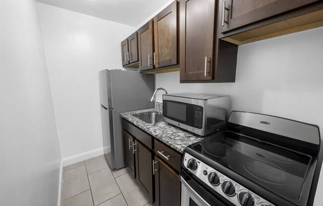 a kitchen with a stove microwave and refrigerator