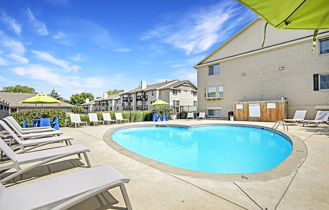 our apartments have a large pool and lounge chairs