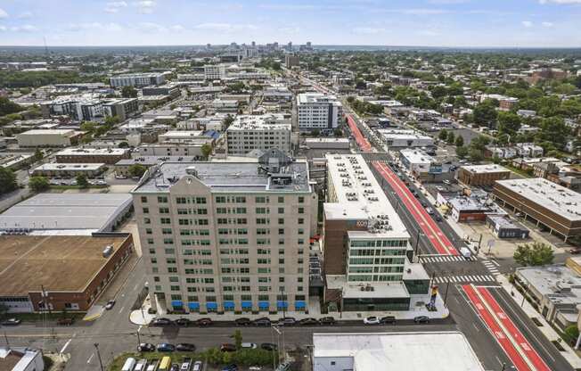 an aerial view of a city with a red train in the middle of the street  at The Icon, Virginia