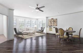 A living room with a dining table and chairs.