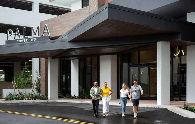 Four people are walking at Palma, Doral, FL, 33166