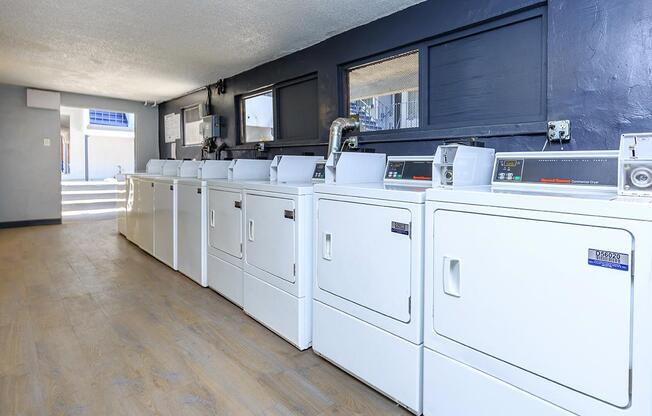 a large white refrigerator in a kitchen