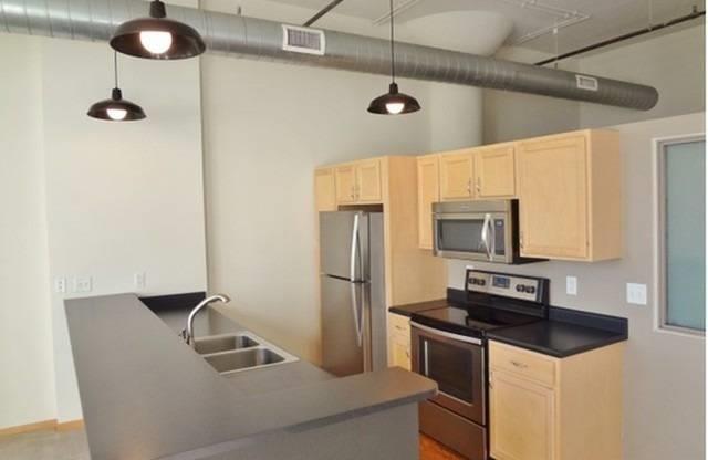 Kitchen with appliances and cabinetsat Boston Lofts, Milwaukee