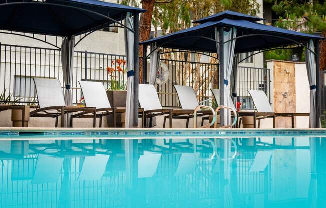 Pool, cabana and chaise lounge chairs at 55+ FountainGlen Goldenwest, Westminster, CA