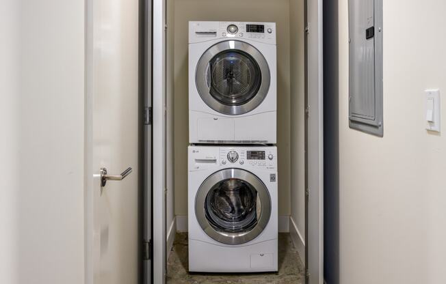 a front loading washer and dryer in a laundry room