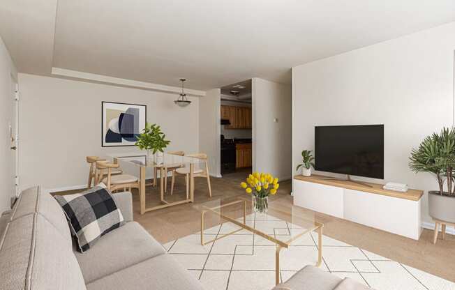 a living room with a couch and a table and a television at halley house apartments in washington dc