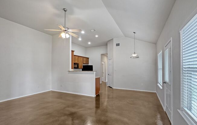 Stained Concrete Flooring - No Carpet! Fridge Included / Fenced in Backyard / Ceiling Fans /Front & Back Yard Mow & Trim Included! / CISD