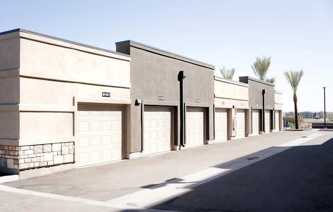 A long building with garage doors on the side.