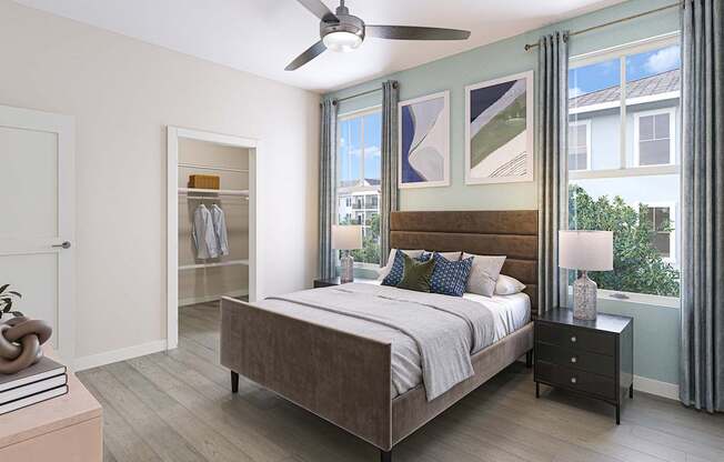A bedroom with a bed, nightstand, and a ceiling fan.