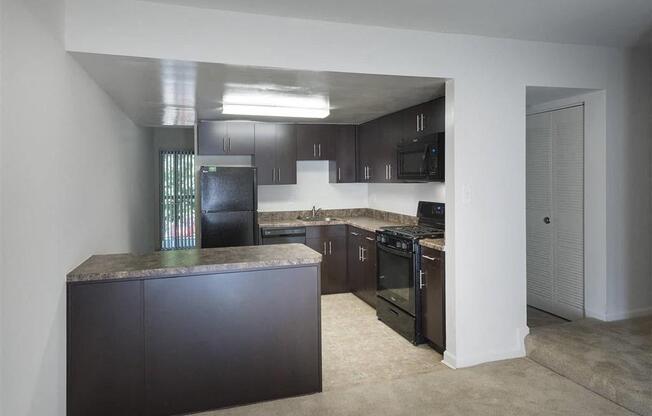 Townhomes-Kitchen with an island in our townhomes  at Trillium Apartments, Fairfax, Virginia