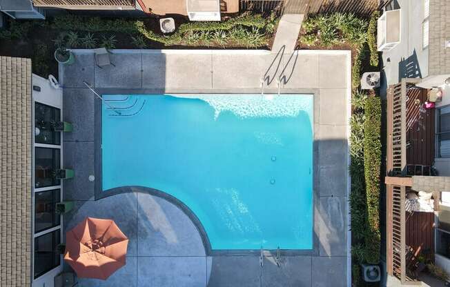 an aerial view of a swimming pool in the backyard of a house at Encore Apartments, Ontario