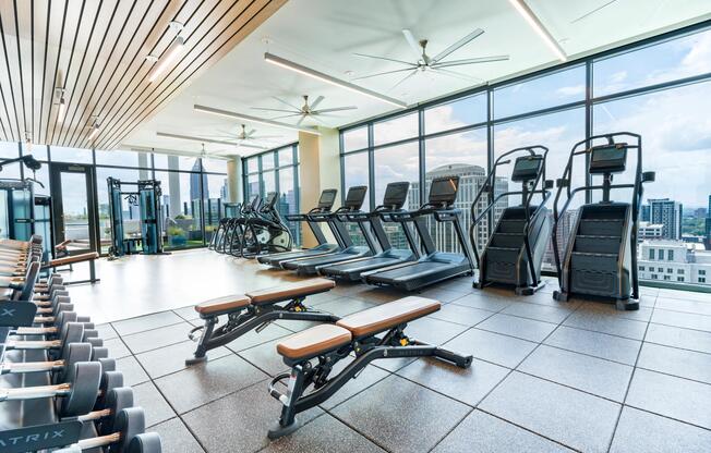 Our sunlit fitness center features expansive city views and modern equipment, keeping Midtown energy close to every workout.