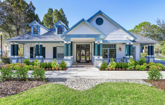 leasing office with blue shutters and white siding