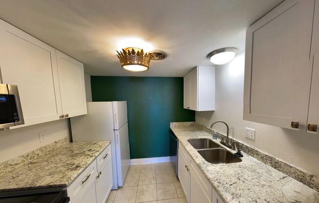 Gated Condo steps from Maple Street & St Charles!