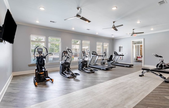 the gym has cardio equipment and treadmills in it