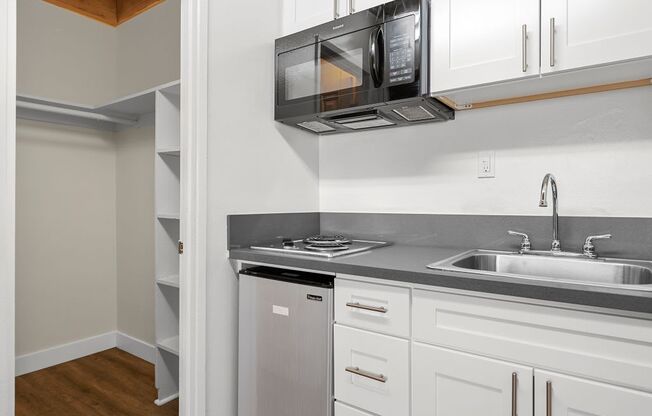 a kitchen with a sink and a microwave