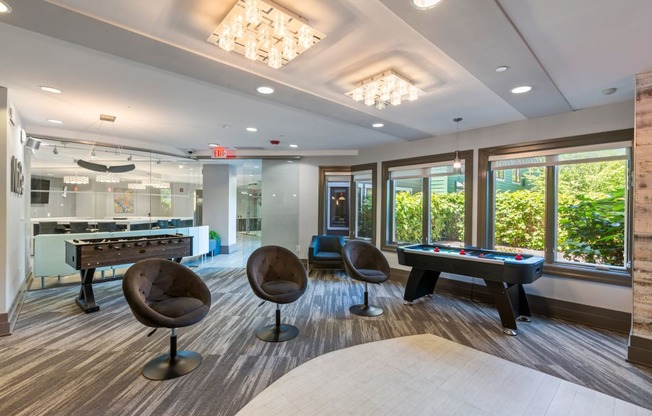 a game room with a pool table and a foosball