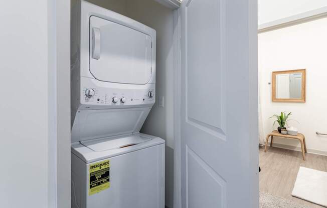 A white oven with a sticker on it is in a room.