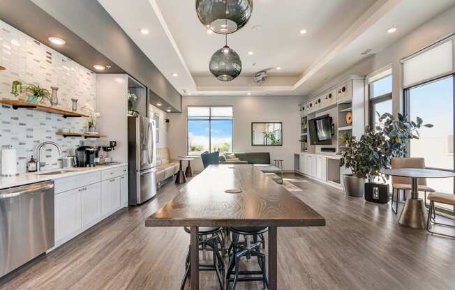 a large kitchen and dining room with a large wooden table at Barrington 101, Barrington Illinois