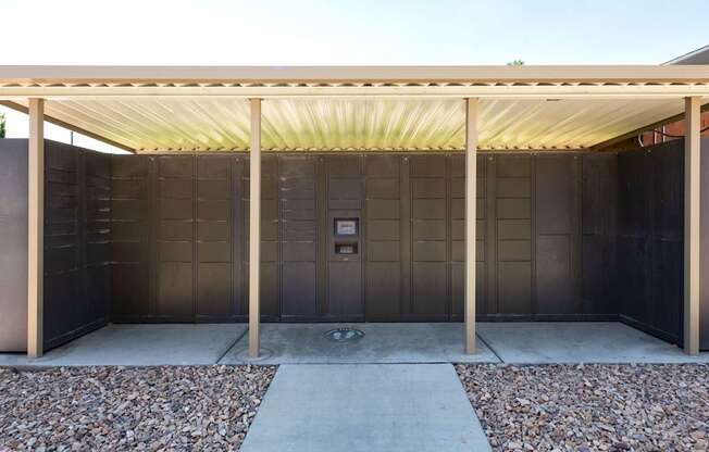 the outside of a building with a covered area and a door