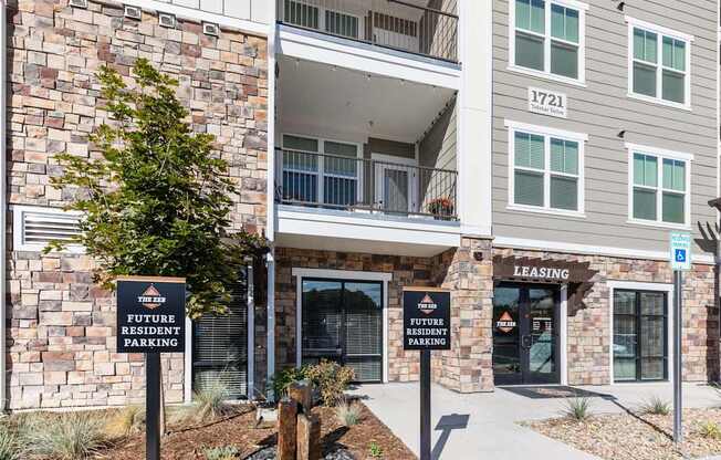 A building with a sign that says "Leasing" and "Future Resident Parking".
