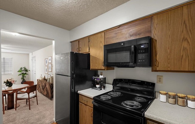 a kitchen with a stove microwave and refrigerator