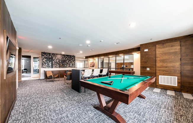 Lenox SoCo Apartments  spacious game room with a pool table