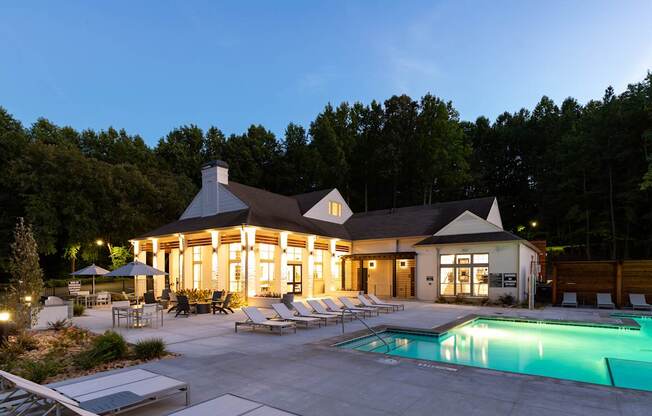 A large house with a pool in the backyard.
