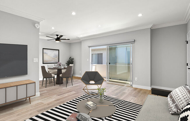 Hardwood floored living room with view of sliding door to private balcony.