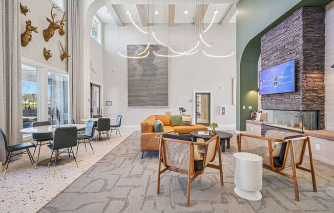 A modern living room with a stone fireplace and a television.