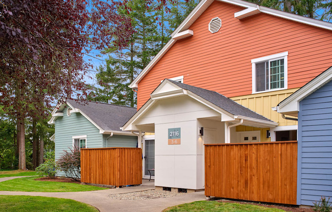 a group of houses with a sidewalk and a fence at Woodcreek, Poulsbo, 98370