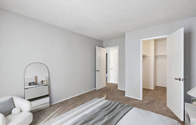 Model Bedroom with Carpet and Walk In Closet at Walnut Creek Apartments located in Walnut Creek, CA.