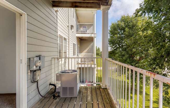 the view from the deck of a home with a heater on the porch