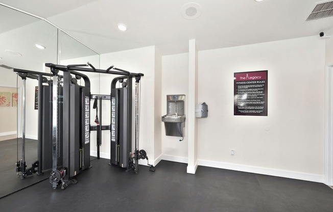 The on-site gym at The Legacy apartments is equipped with cardio machines and weights