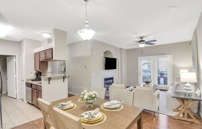 a kitchen and dining room with a table and chairs