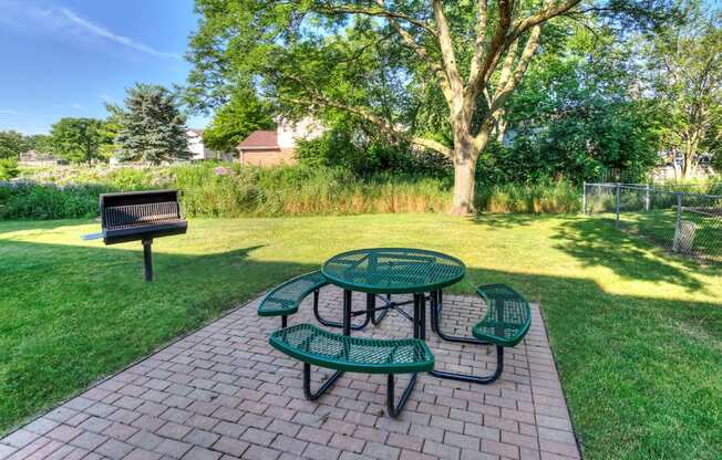 Courtyard with BBQ Area and Lush Gardens, at Eagle Creek Apartments, Illinois