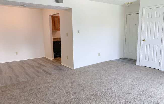 Large dining room open to the living room at Waterstone Place Apartments in Indianapolis, IN46229